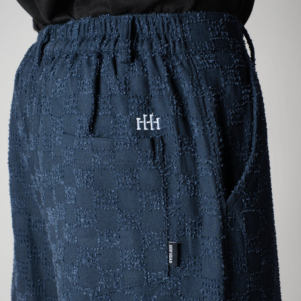 BLUE CHECKERED ROOFING BOOT CUT DENIM