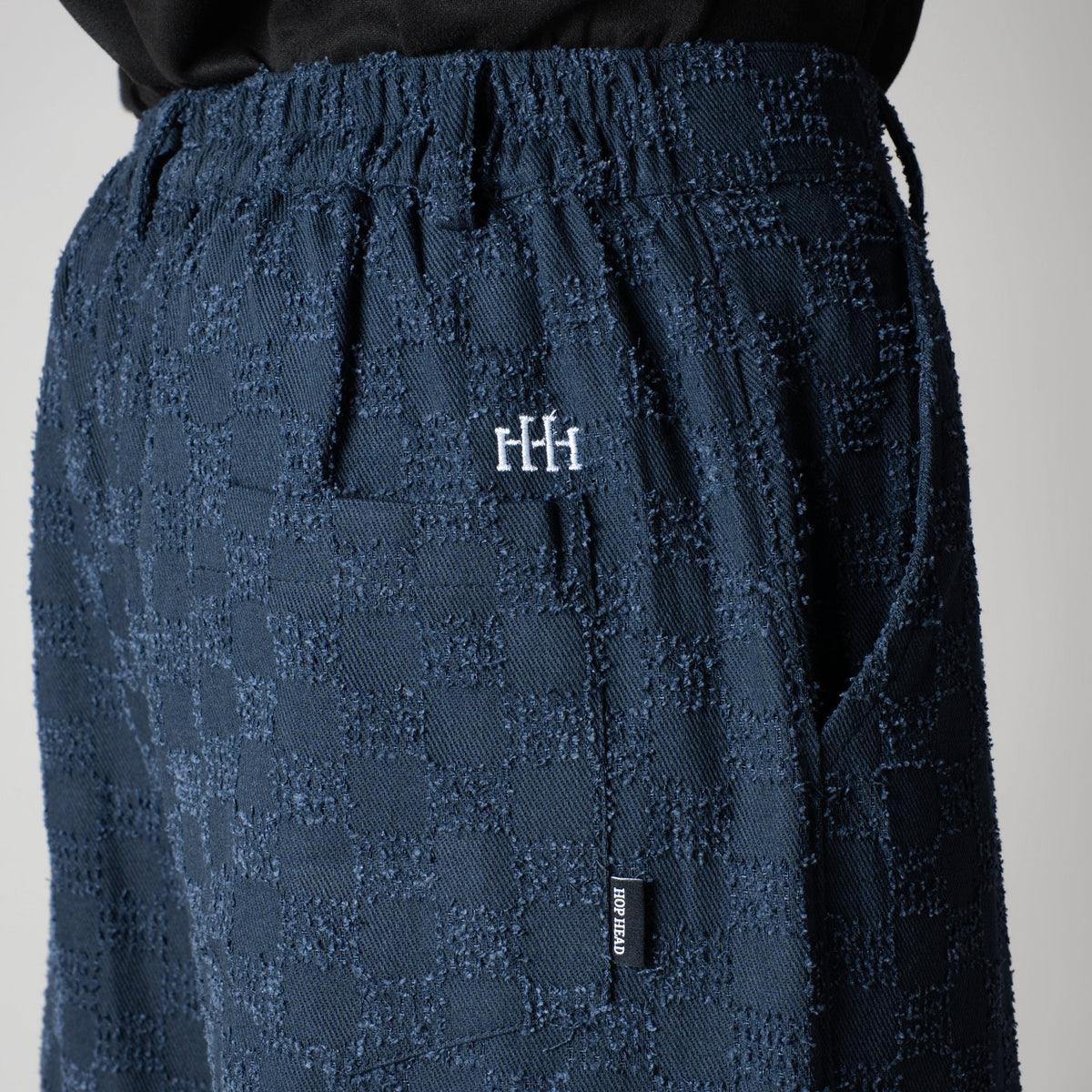 BLUE CHECKERED ROOFING BOOT CUT DENIM